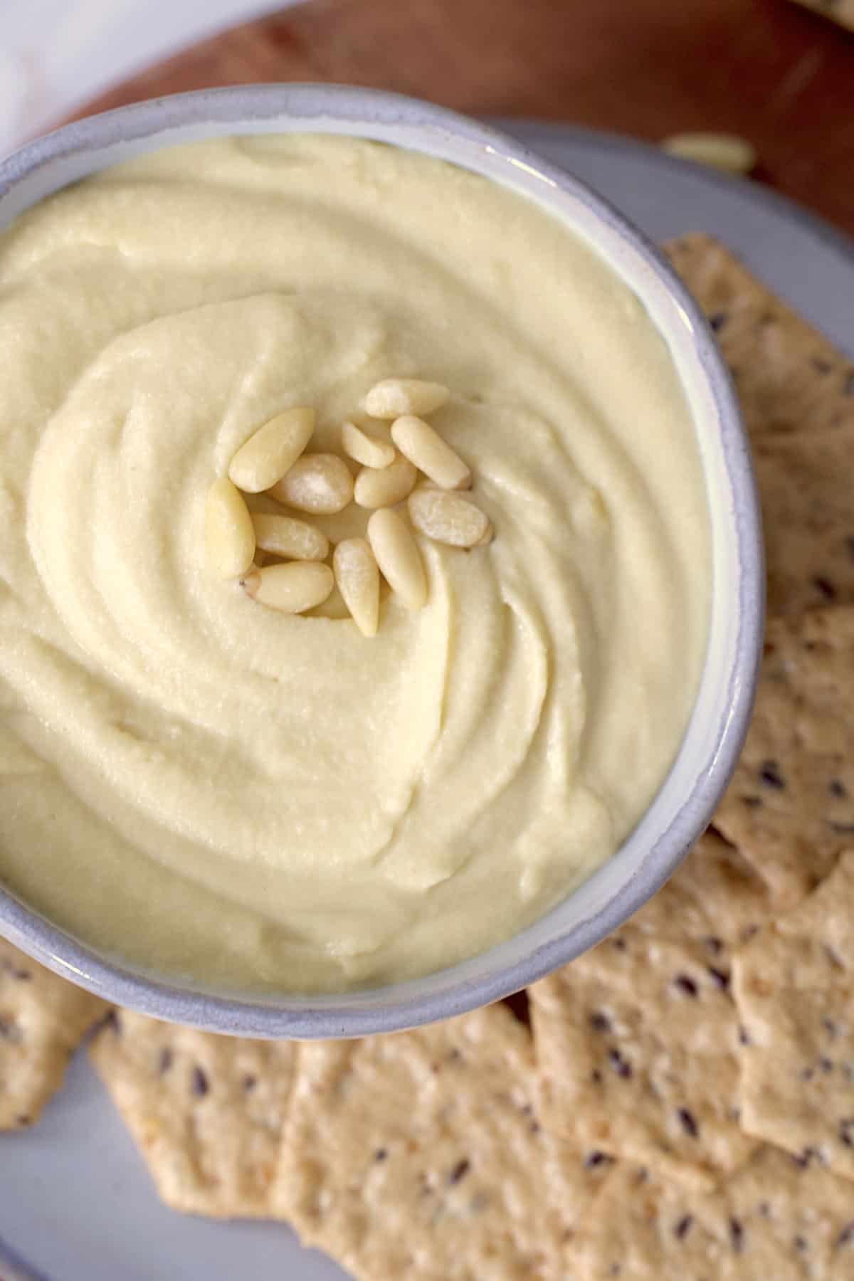 authentic Syrian hummus in a bowl with crackers