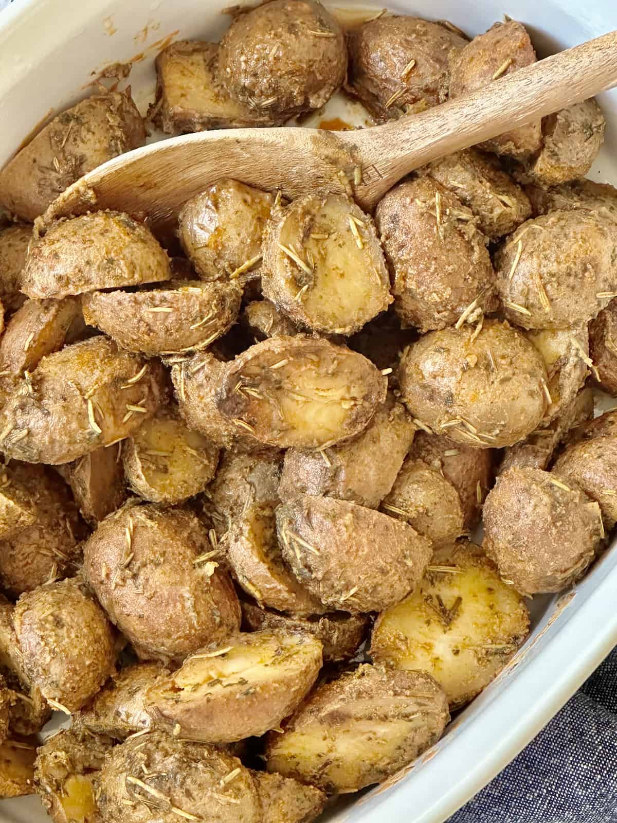 slow cooker baby potatoes in a white casserole dish