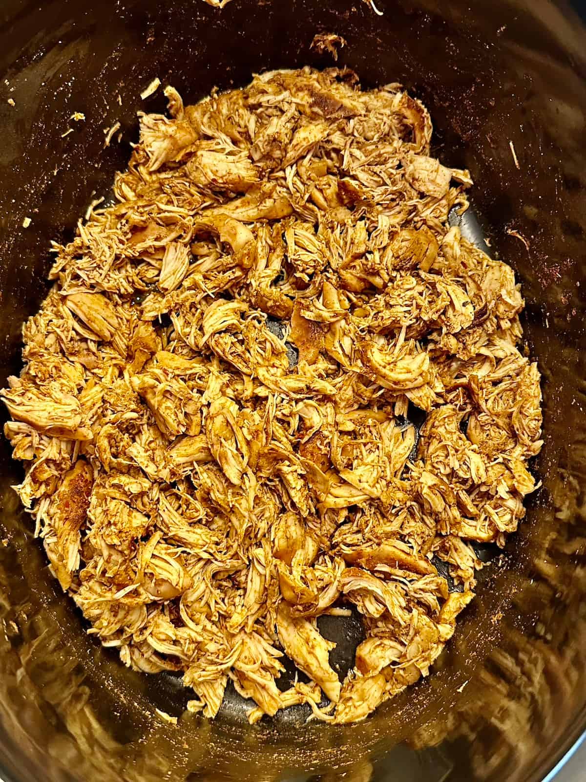 shredded taco chicken in a crockpot