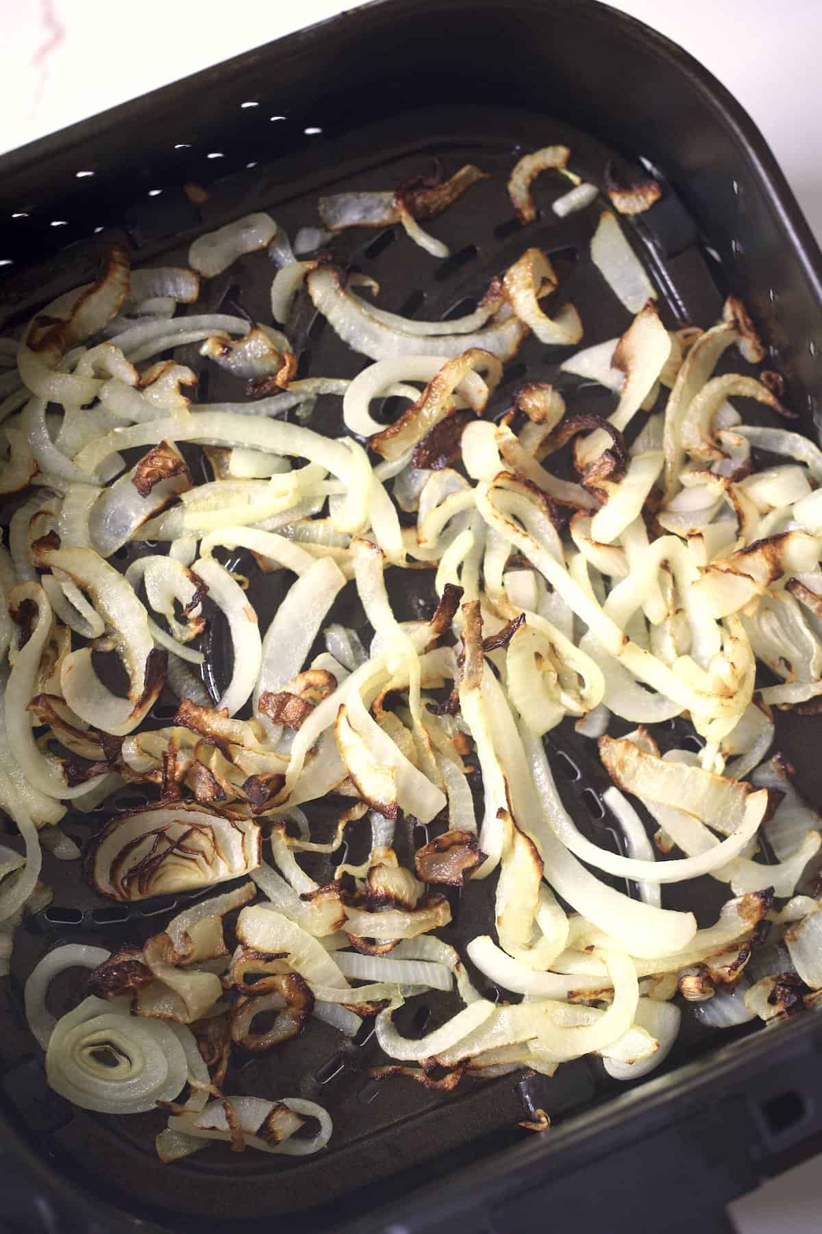 roasted onions in the air fryer basket