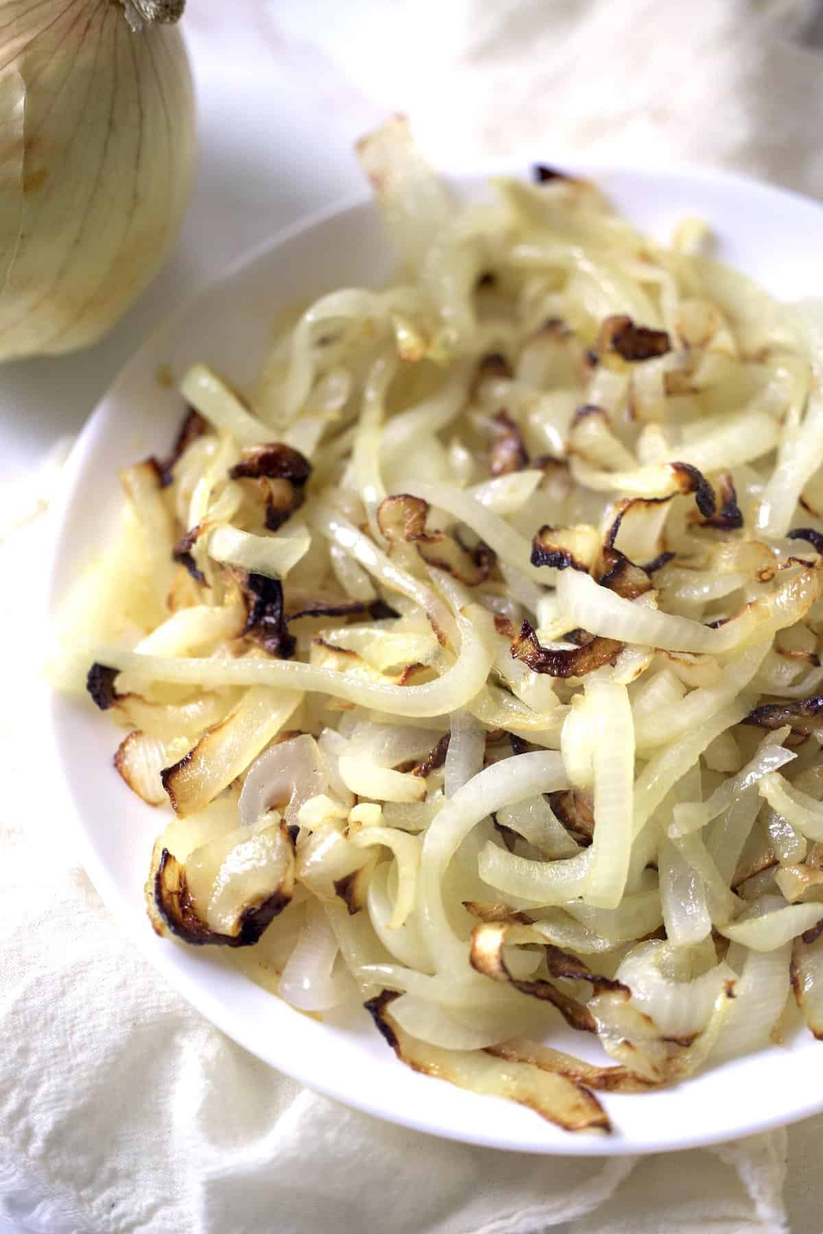 air fried caramelized onions on a white plate