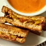 air fried bacon grilled cheese on a plate with tomato soup