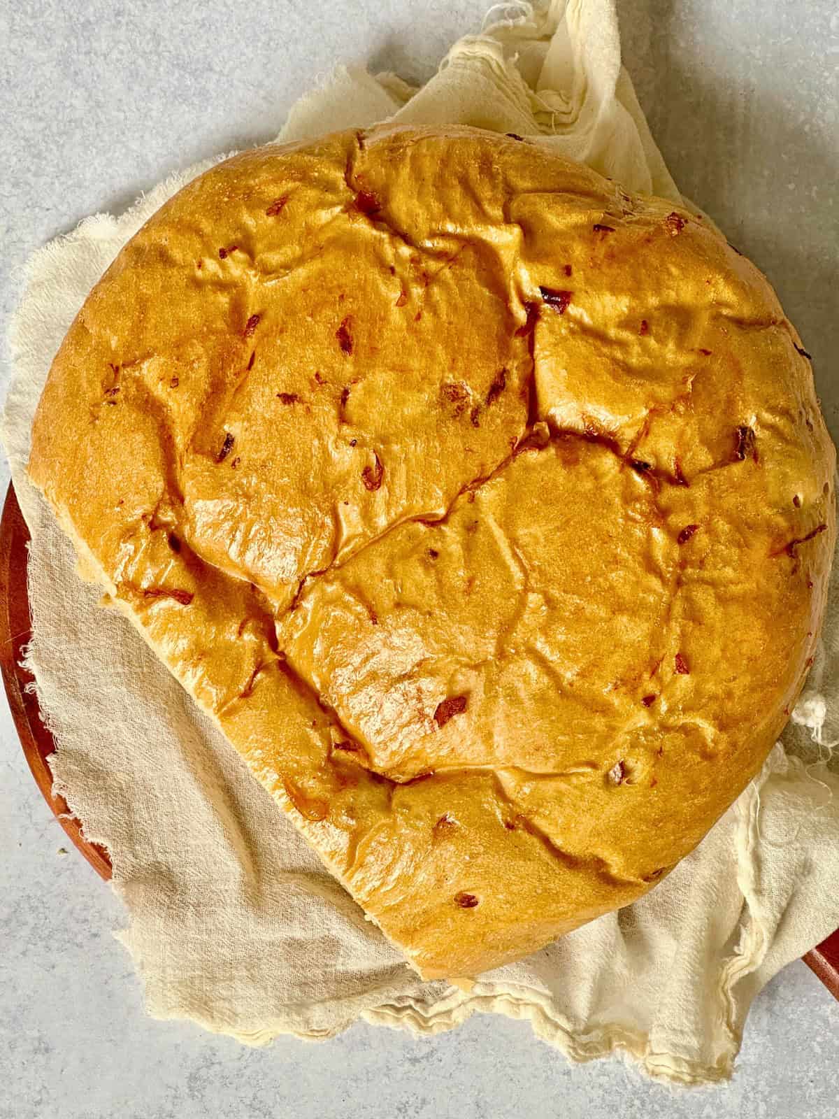 sliced onion bread on a cheesecloth