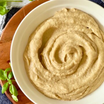 crockpot mashed cauliflower in a white bowl