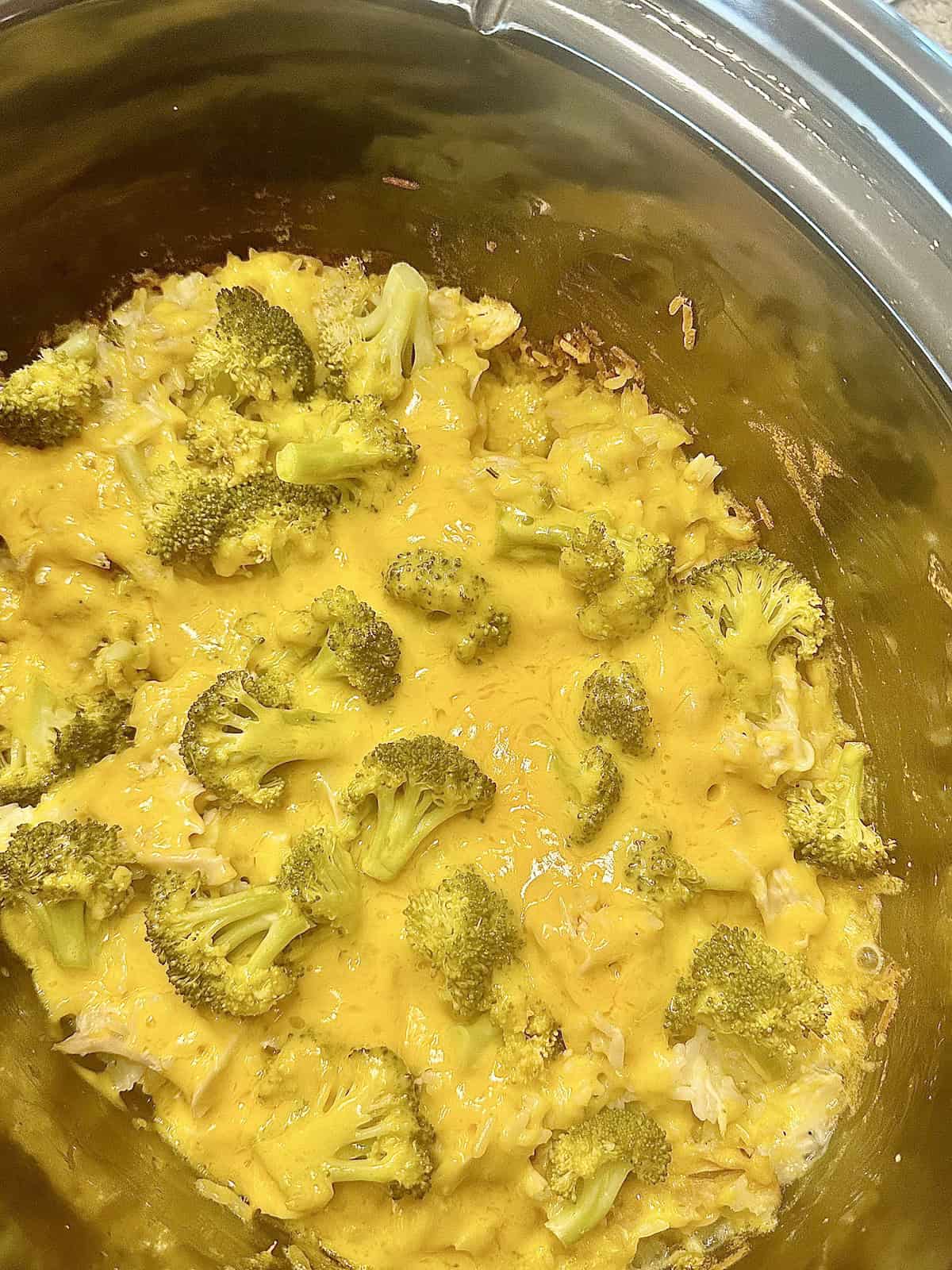 melted cheese, and broccoli in a crockpot
