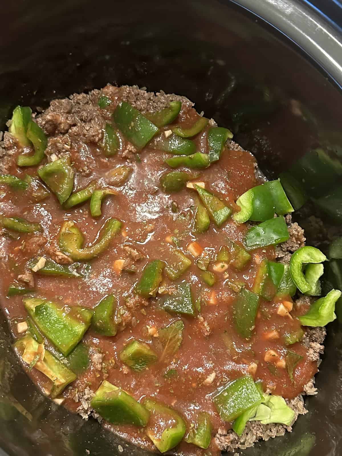 bell peppers, ground beef, rice, tomato sauce, mint and allspice in a slow cooker