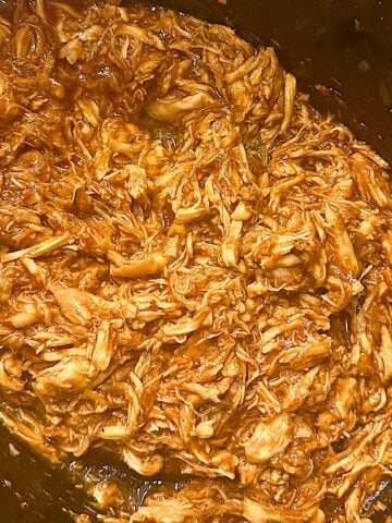 slow cooker barbecue chicken pulled in a slow cooker