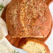 rosemary parmesan bread on a serving board