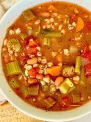 pressure cooker vegetable farro soup in a white bowl