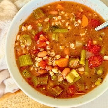 pressure cooker vegetable farro soup in a white bowl