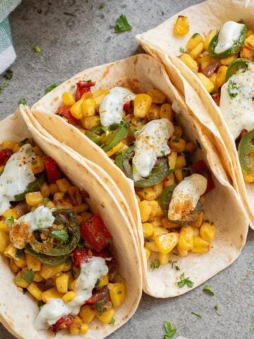 Mexican street corn tacos on a plate