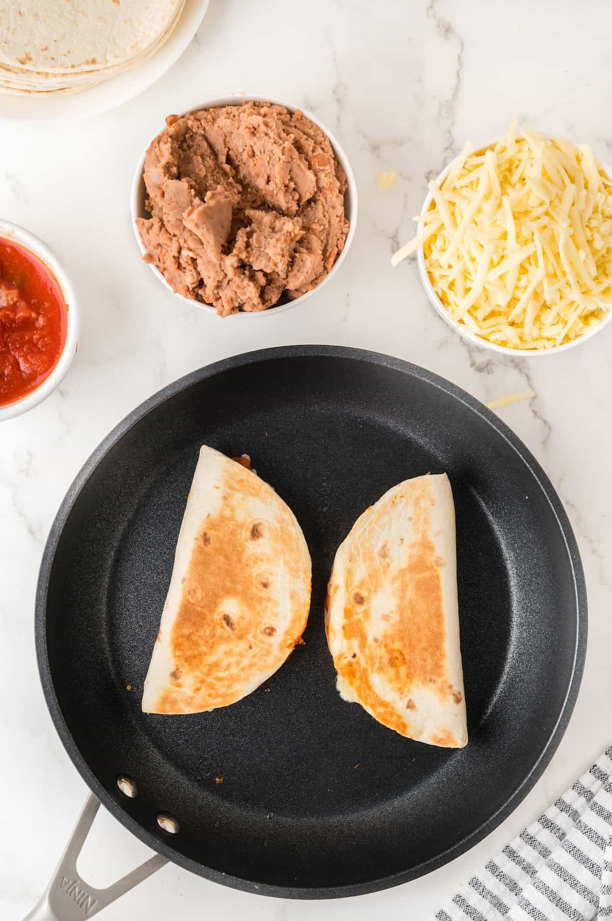 quesadillas in a frying pan