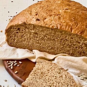 bread machine sunflower seed bread slided on a cutting board