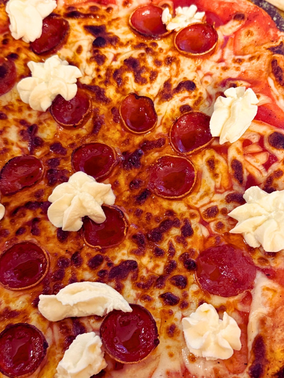 close up of hot honey pepperoni ricotta pizza