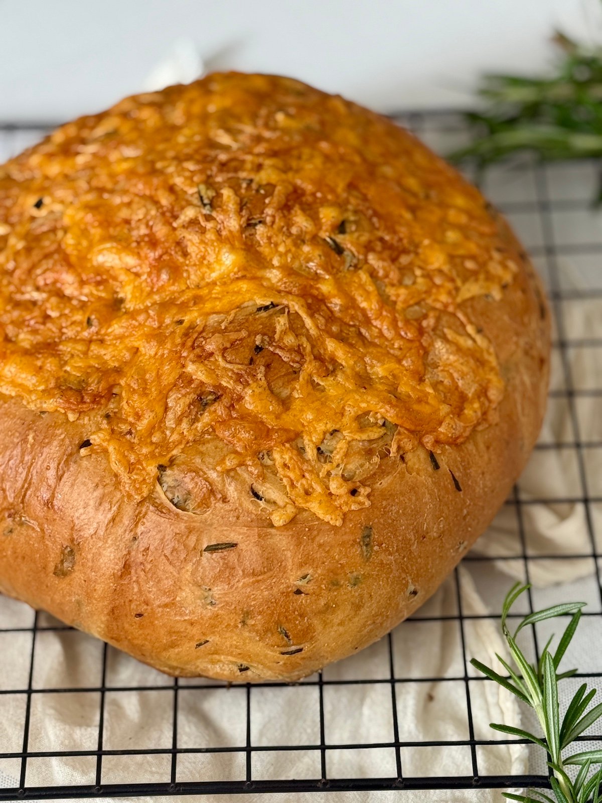bread maker herb and garlic bread on a cooling rack