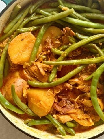moroccan chicken stew and vegetables in a stock pot