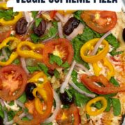 loaded veggie supreme pizza on a pizza peel