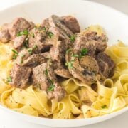 beef stroganoff cooked in a crockpot served over egg noodles