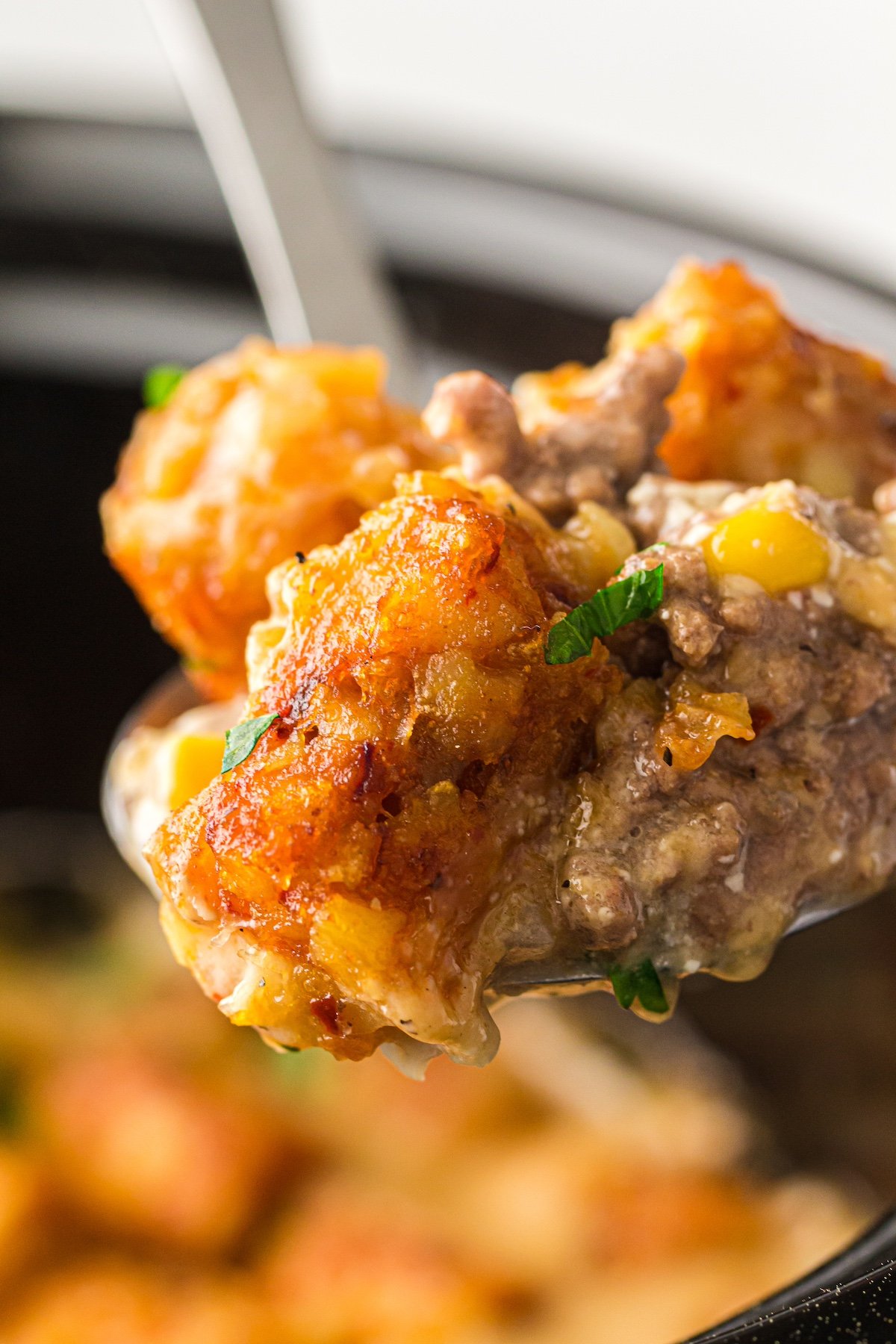 close up of a spoonful of cowboy casserole