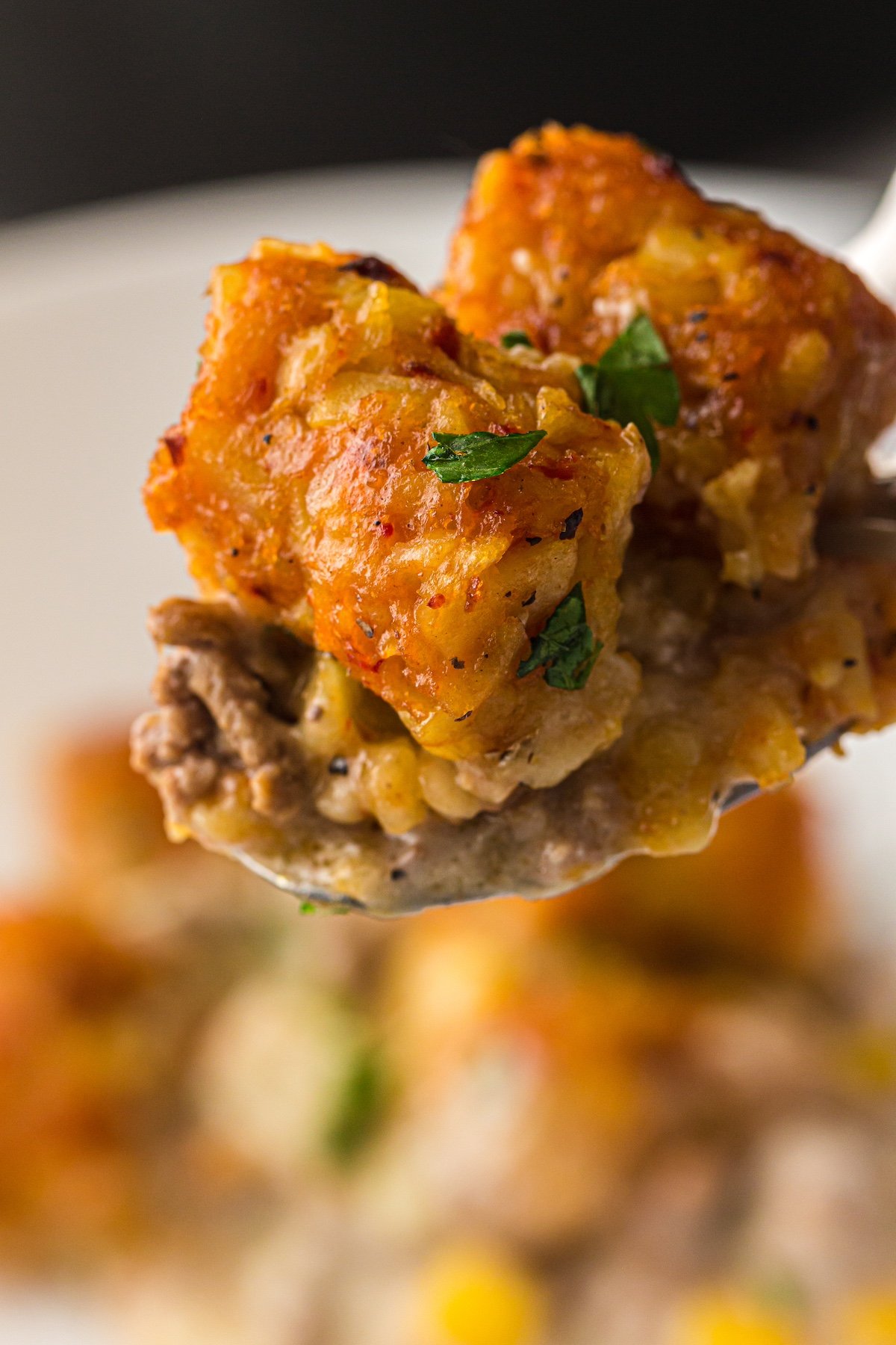 close up of slow cooker cowboy casserole on a fork