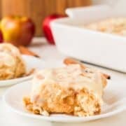 apple cinnamon roll sliced open on a plate