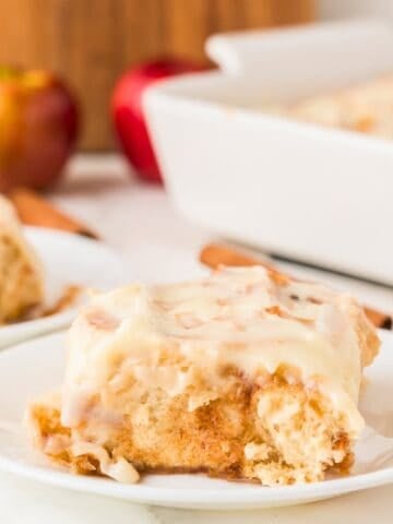 apple cinnamon roll sliced open on a plate