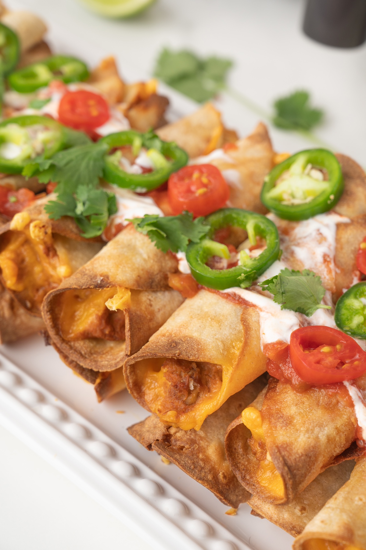 refried bean taquitos on a serving plate