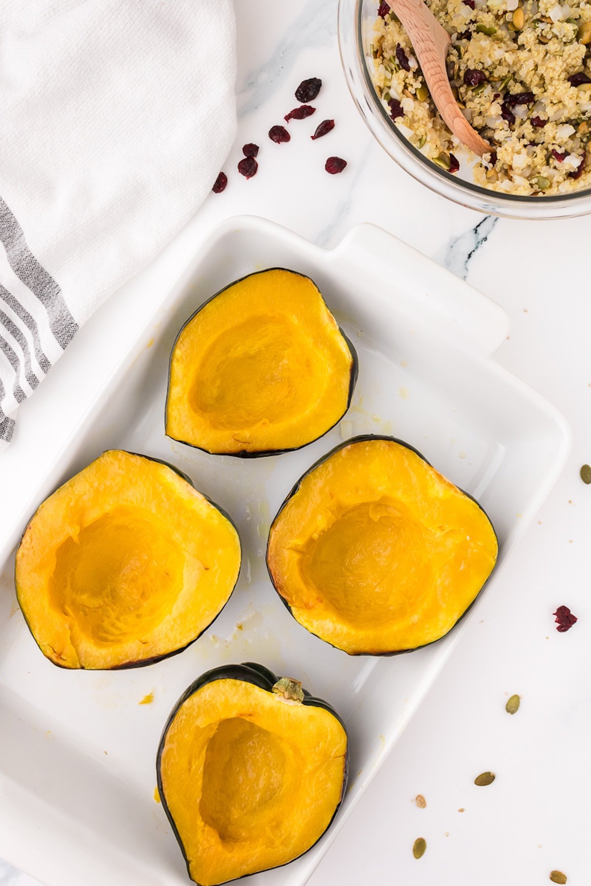baked acorn squash on a baking sheet