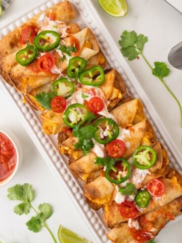 refried bean taquitos on a serving plate
