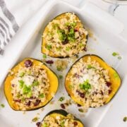 stuffed acorn squash on a white plate