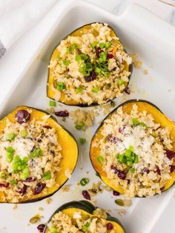 stuffed acorn squash on a white plate