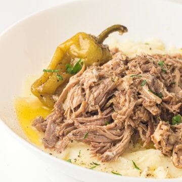 slow cooker mississippi pot roast in a white plate