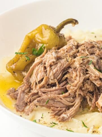 slow cooker mississippi pot roast in a white plate
