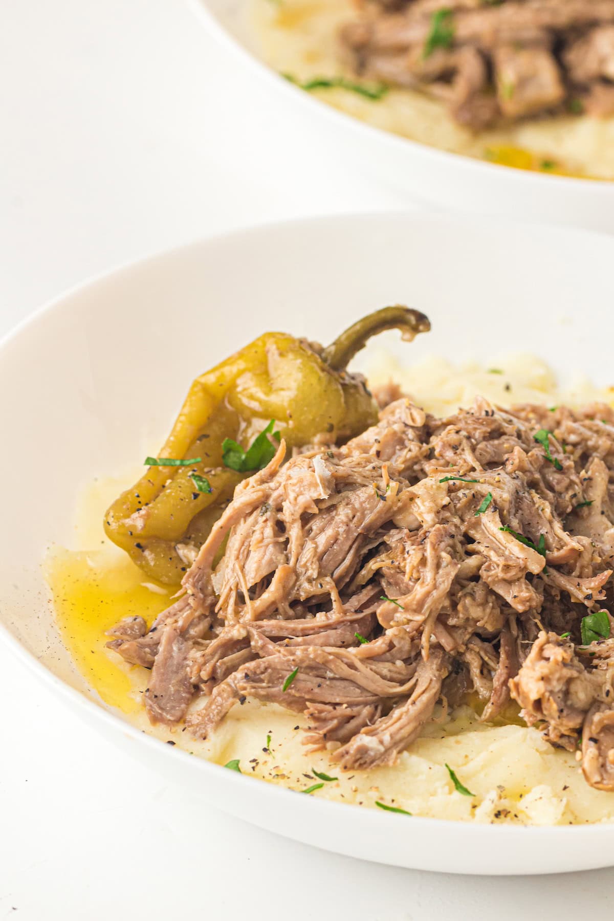 crockpot mississippi pot roast in a white plate