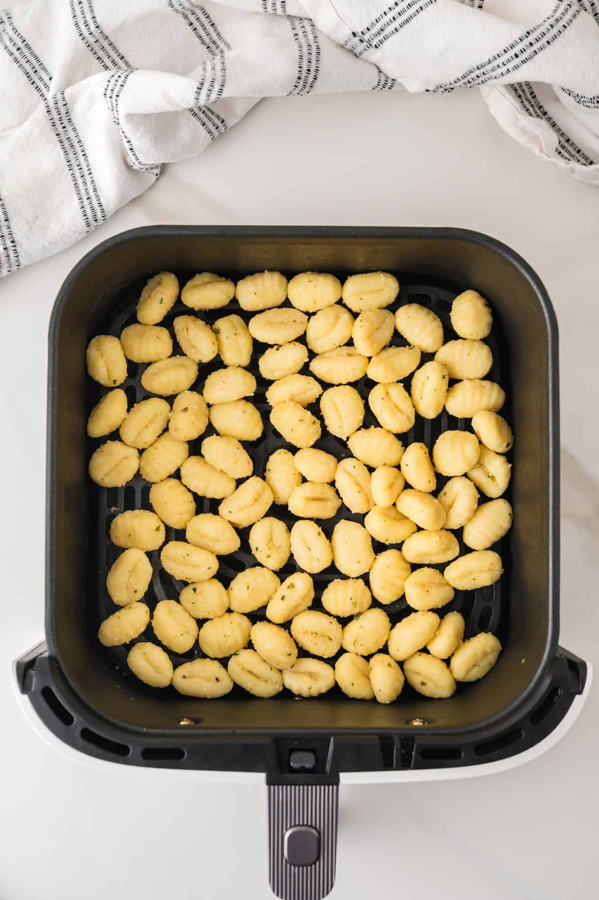 uncooked gnocchi in the air fryer basket