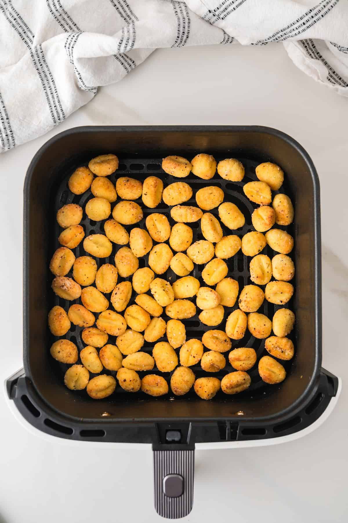 cooked gnocchi in the air fryer basket