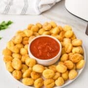 air fried gnocchi in a plate with marinara sauce