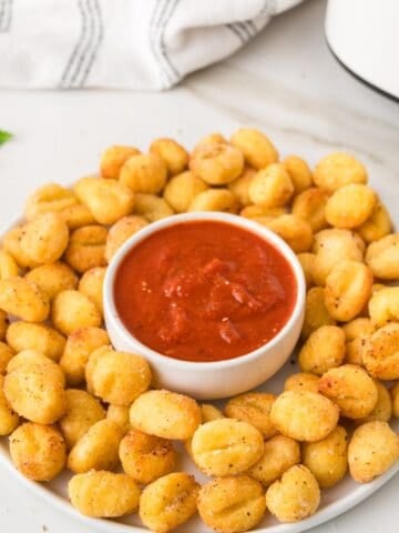 air fried gnocchi in a plate with marinara sauce