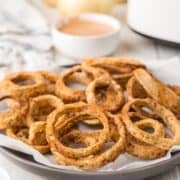 air fryer onion rings on a white platter