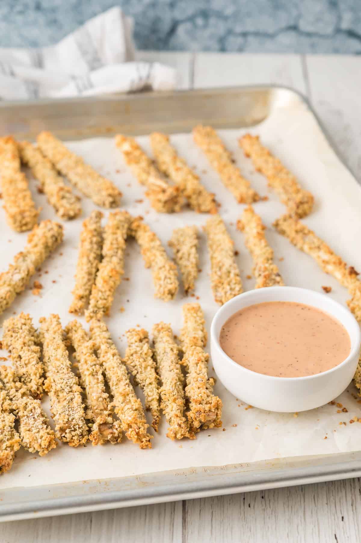 eggplant fries on a baking sheet