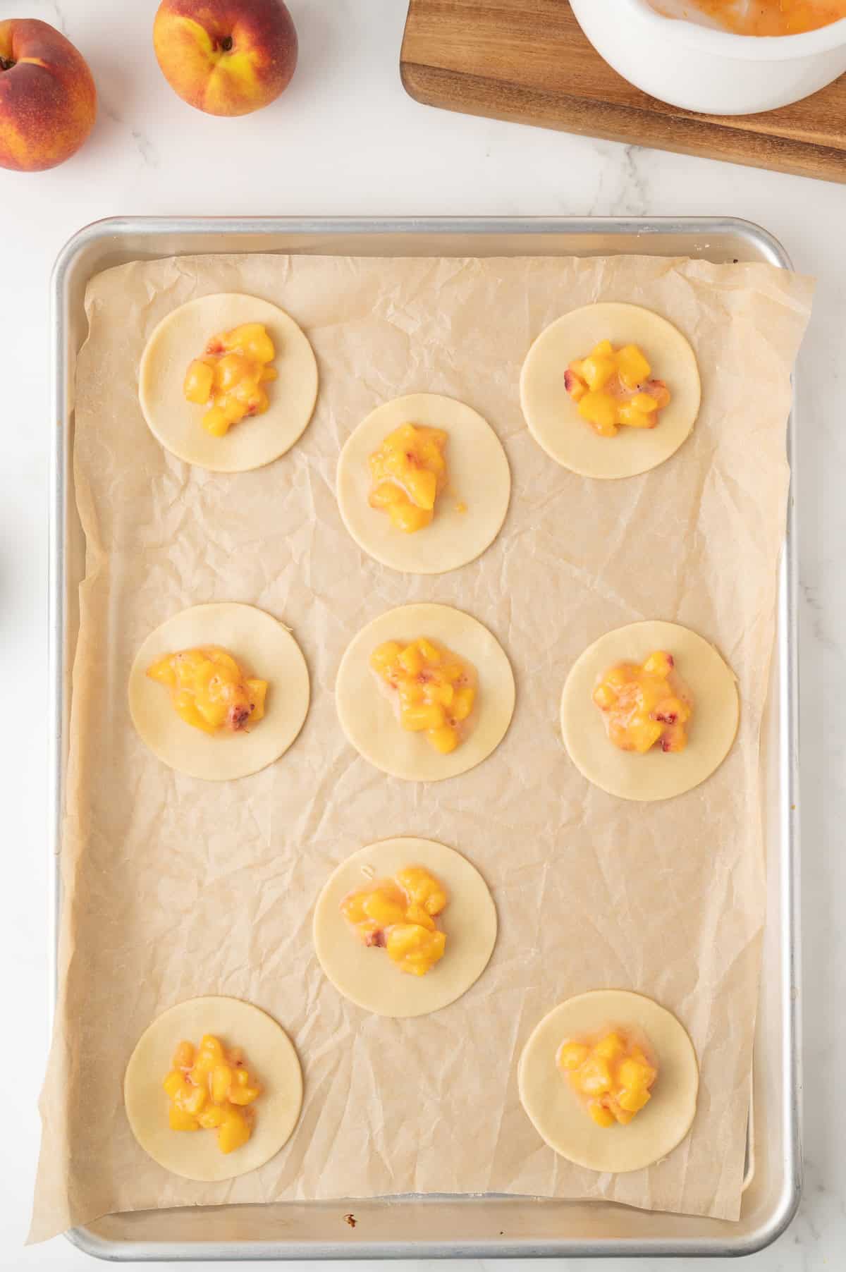 pie filling in the center of circular cut pie crust