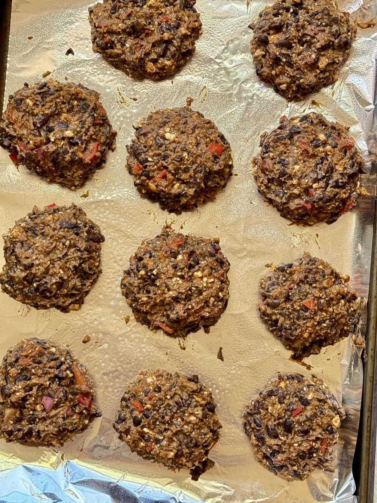 uncooked black bean patties on a baking sheet