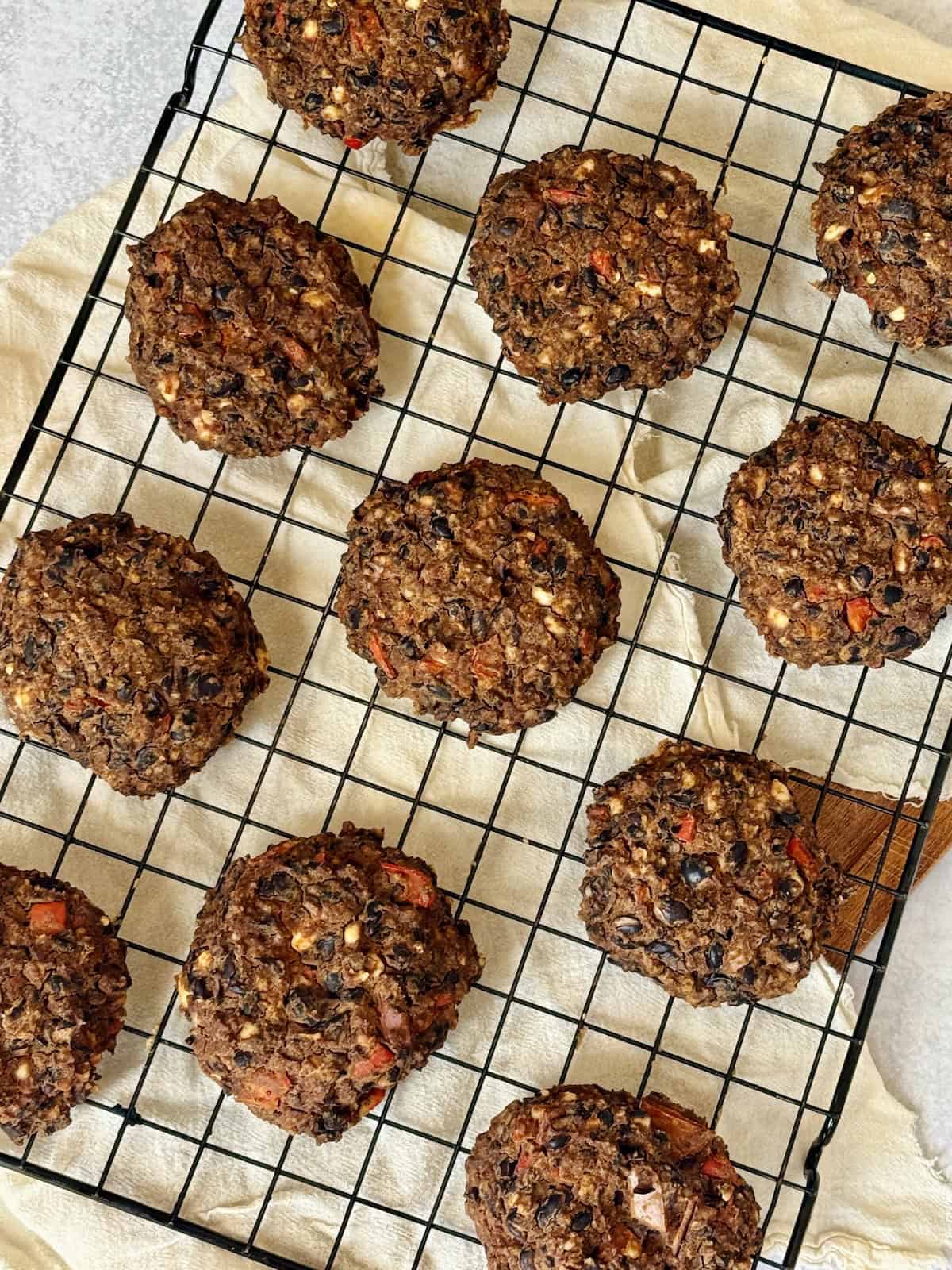 cooked black bean burgers on a cooling rack