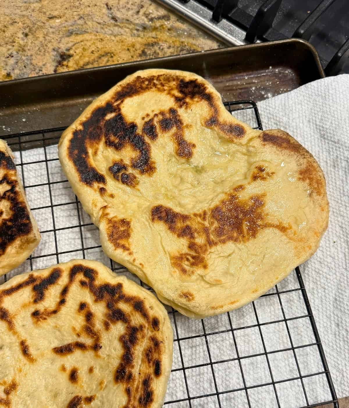naan bread on a cooling rack