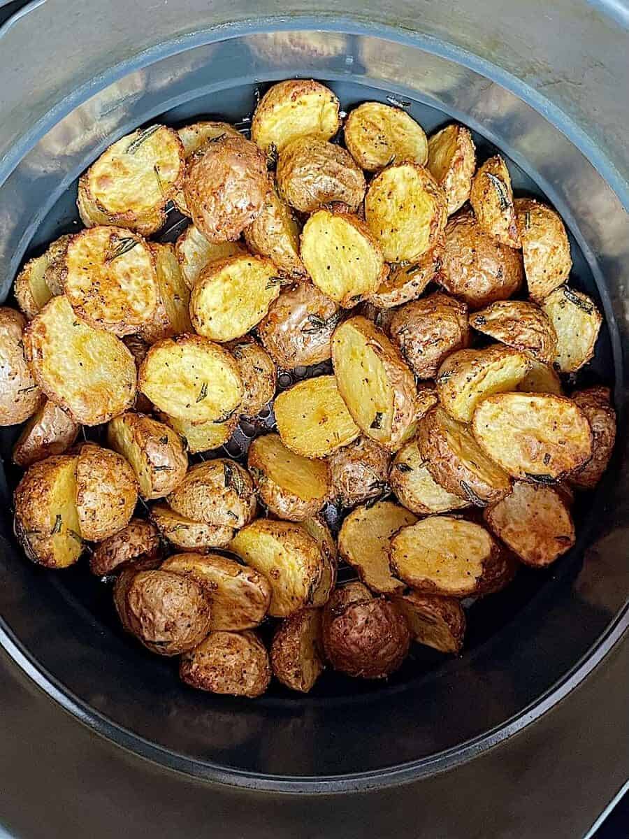 cooked baby potatoes in an air fryer basket