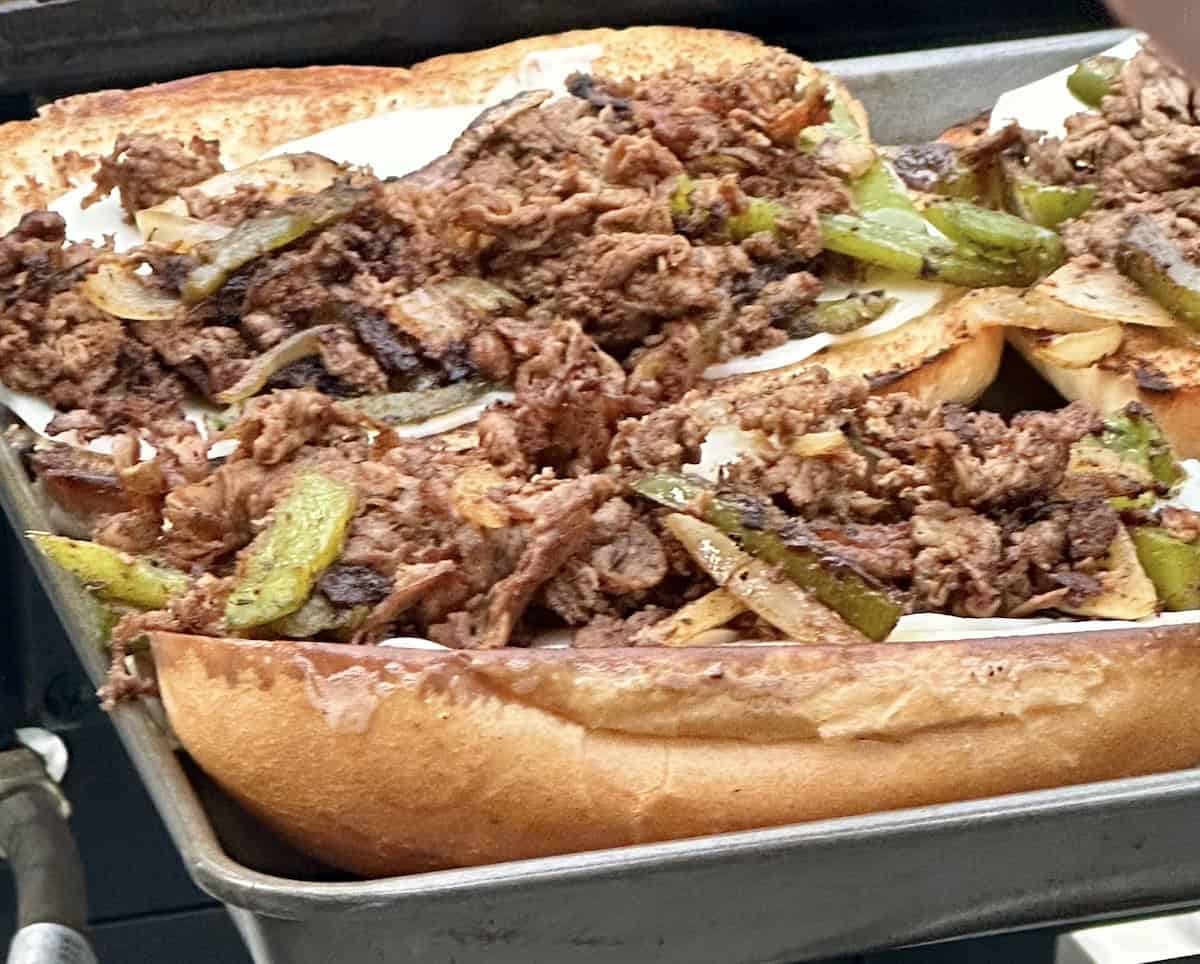 philadelphia cheesesteak sandwiches on a serving tray