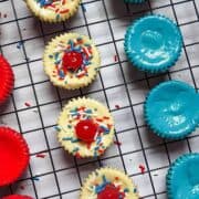 patriotic mini cheesecakes on a cooling rack