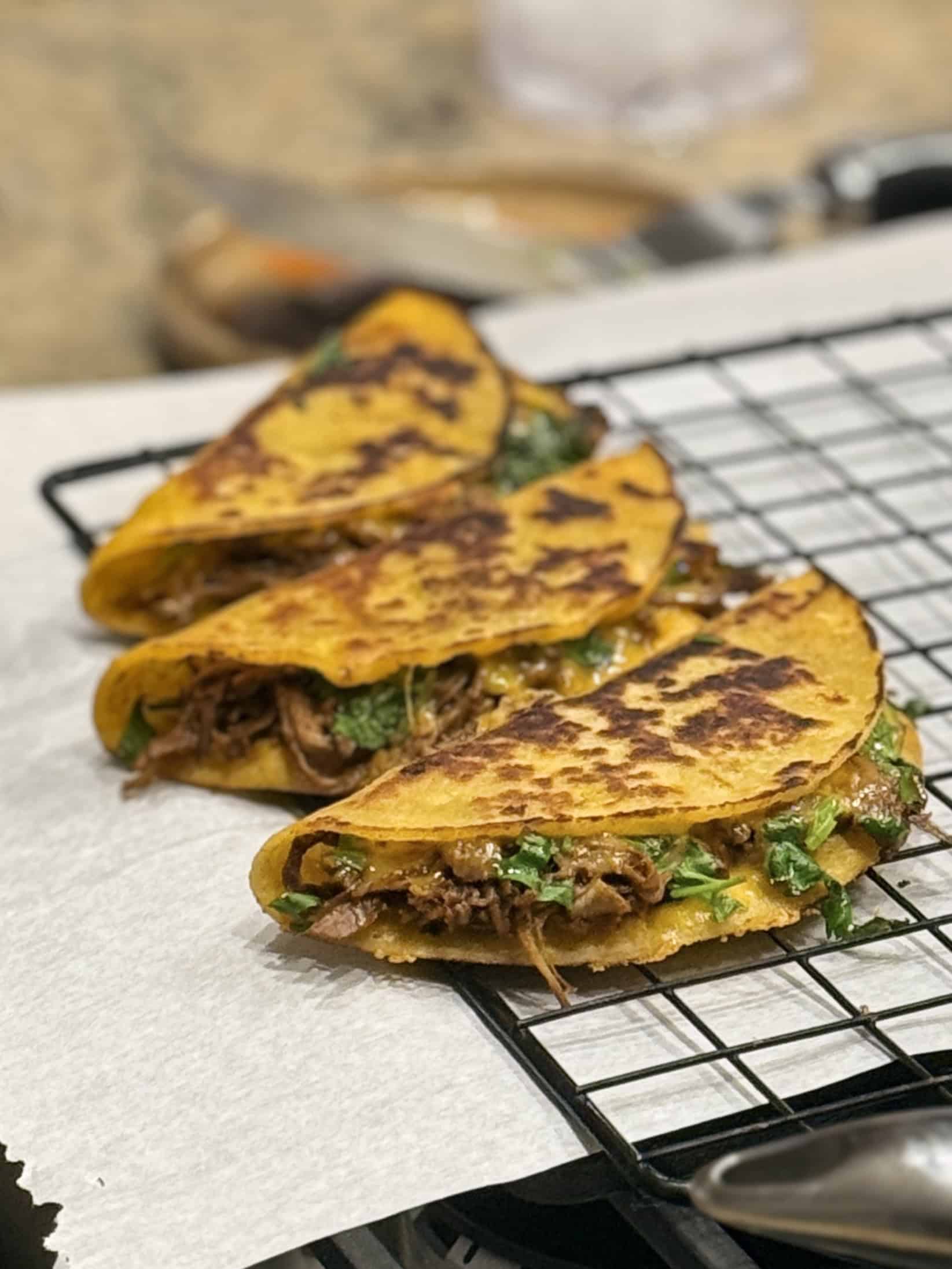 slow cooker birria tacos on a plate