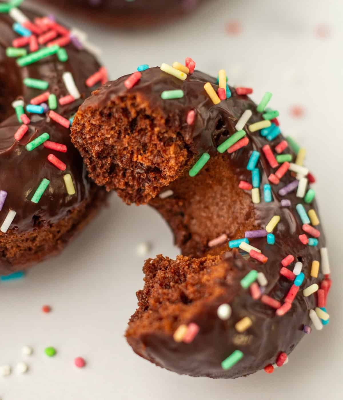 sliced chocolate donut with chocolate ganache