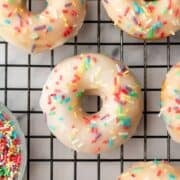 baked vanilla donuts on a cooling rack